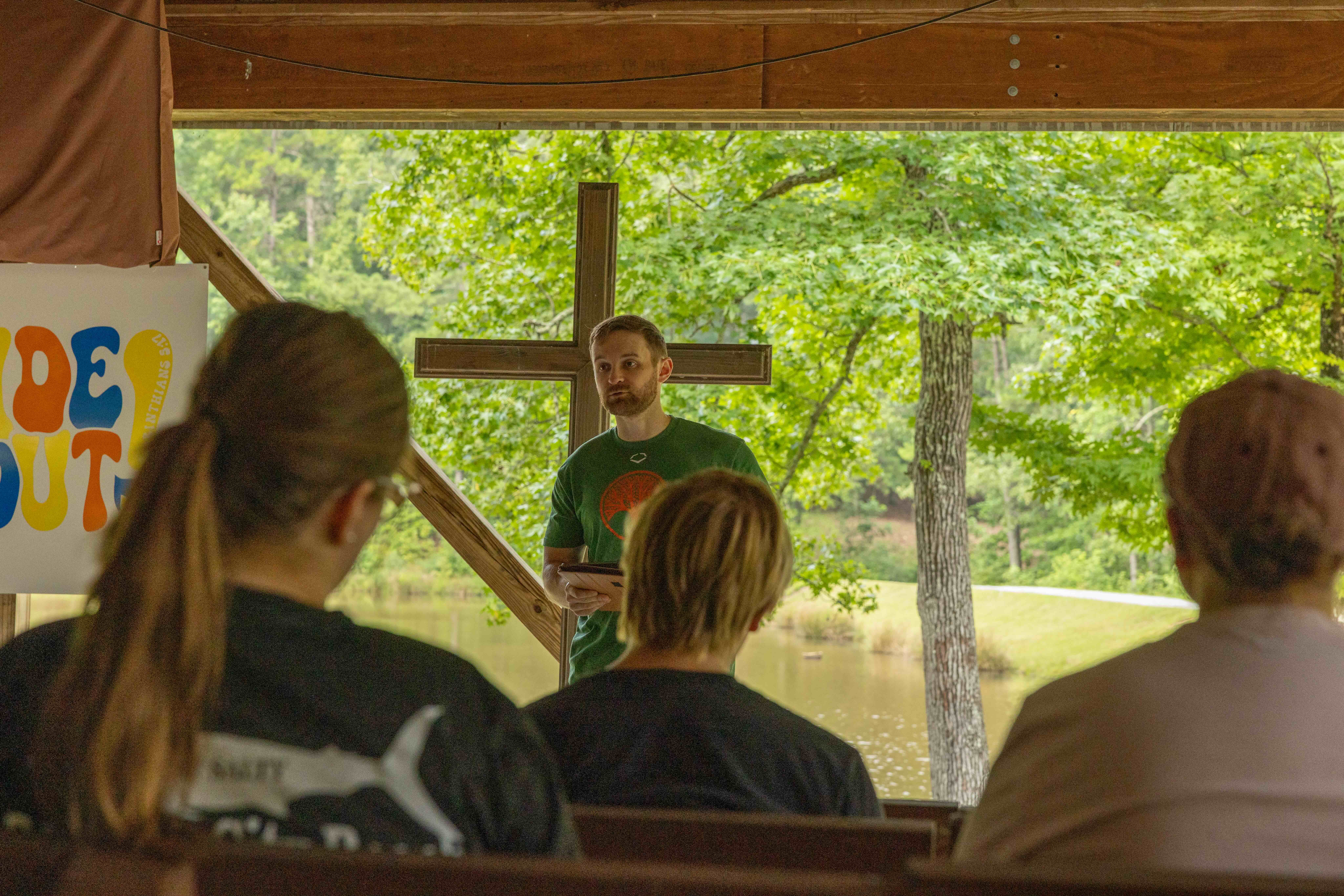 man preaching about the Bible in an outdoor setting